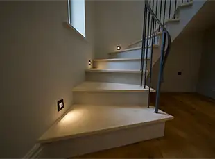 curved stairs with lights